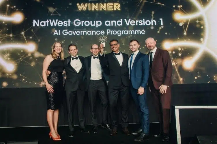 NatWest Group and Version 1 team on stage at the DataIQ Awards 2025 after winning Best Data Governance with AI Initiative for their AI Governance Programme.