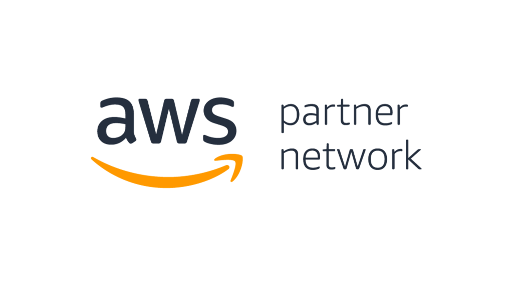 The image shows the AWS Partner Network logo on a transparent checkerboard background. On the left, large dark grey lowercase letters spell “aws,” with the distinctive orange curved arrow (smile) beneath. On the right, the words “partner network” appear in a thinner dark grey font stacked on two lines. The overall layout is horizontal, with the AWS logo and smile on the left and the partner designation text on the right.