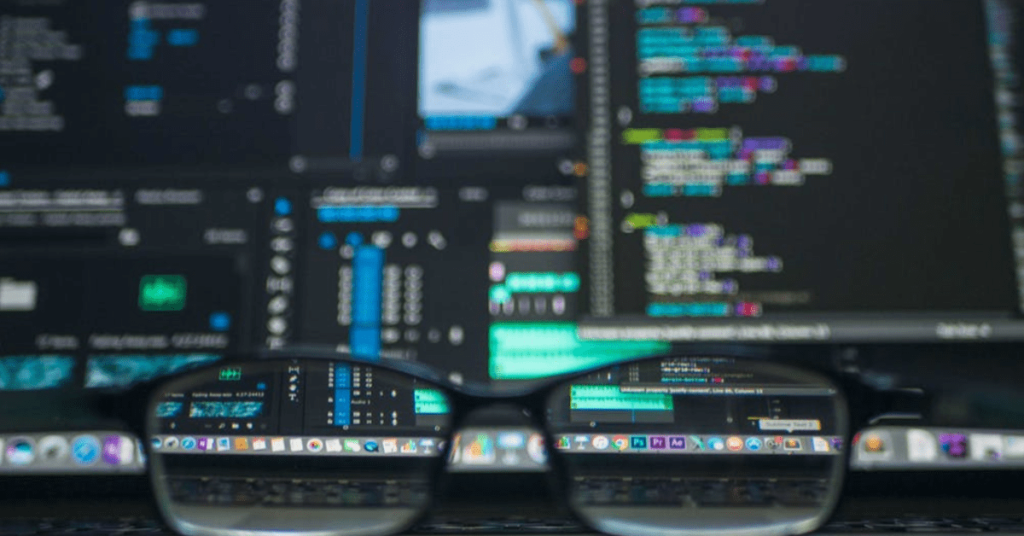 computer screens seen through a pair of glasses