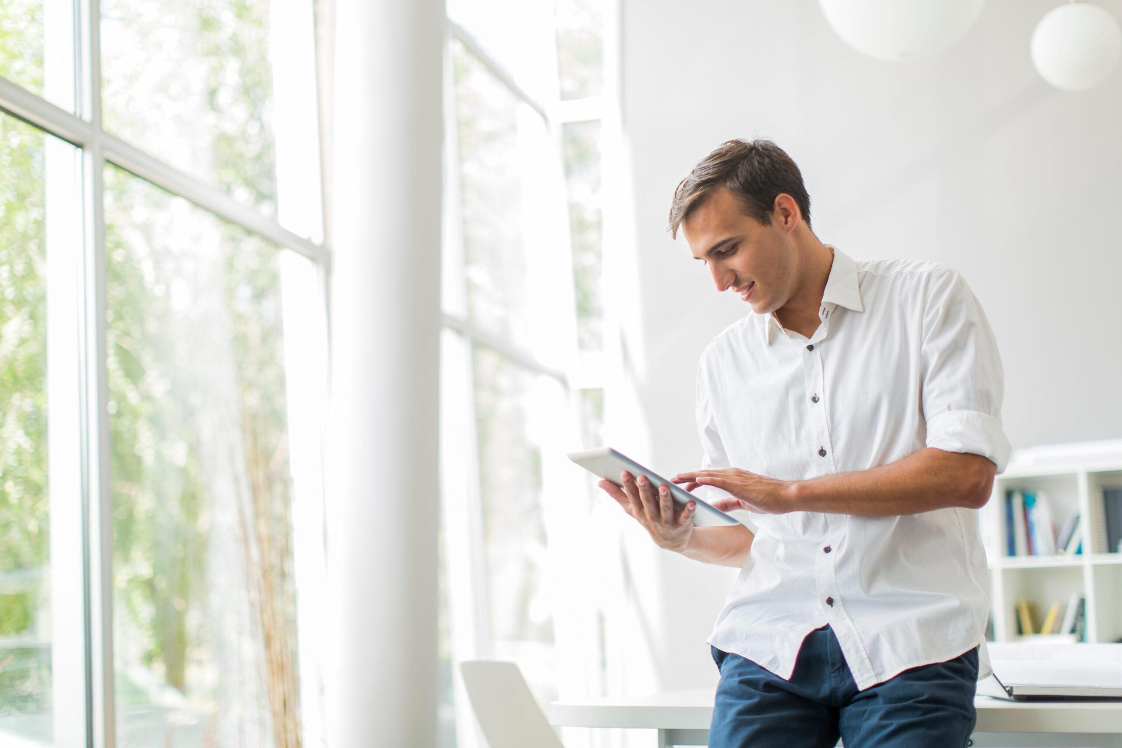 Young man with tablet in the office