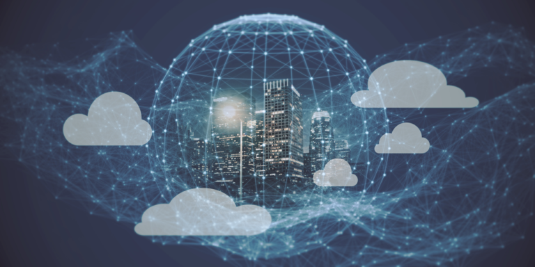 The image presents a futuristic visualization of a smart, connected city integrated with cloud computing technology, set against a deep blue, digitally themed background, where a modern urban skyline with tall, illuminated skyscrapers stands at the center enclosed within a large, semi-transparent spherical network dome composed of intersecting lines and glowing nodes, symbolizing a digital infrastructure or global connectivity grid; surrounding the sphere are several stylized white cloud icons of varying sizes, positioned at different distances, representing distributed cloud systems, while an intricate web of bright, electric-blue lines and connection points spreads across the entire scene, linking the clouds and the central city, suggesting constant data exchange and network communication, and the overall composition uses cool tones, glowing highlights, and a layered, holographic effect to convey advanced concepts such as smart cities, cloud computing ecosystems, data networks, and the seamless integration of physical urban environments with digital cloud-based technologies.