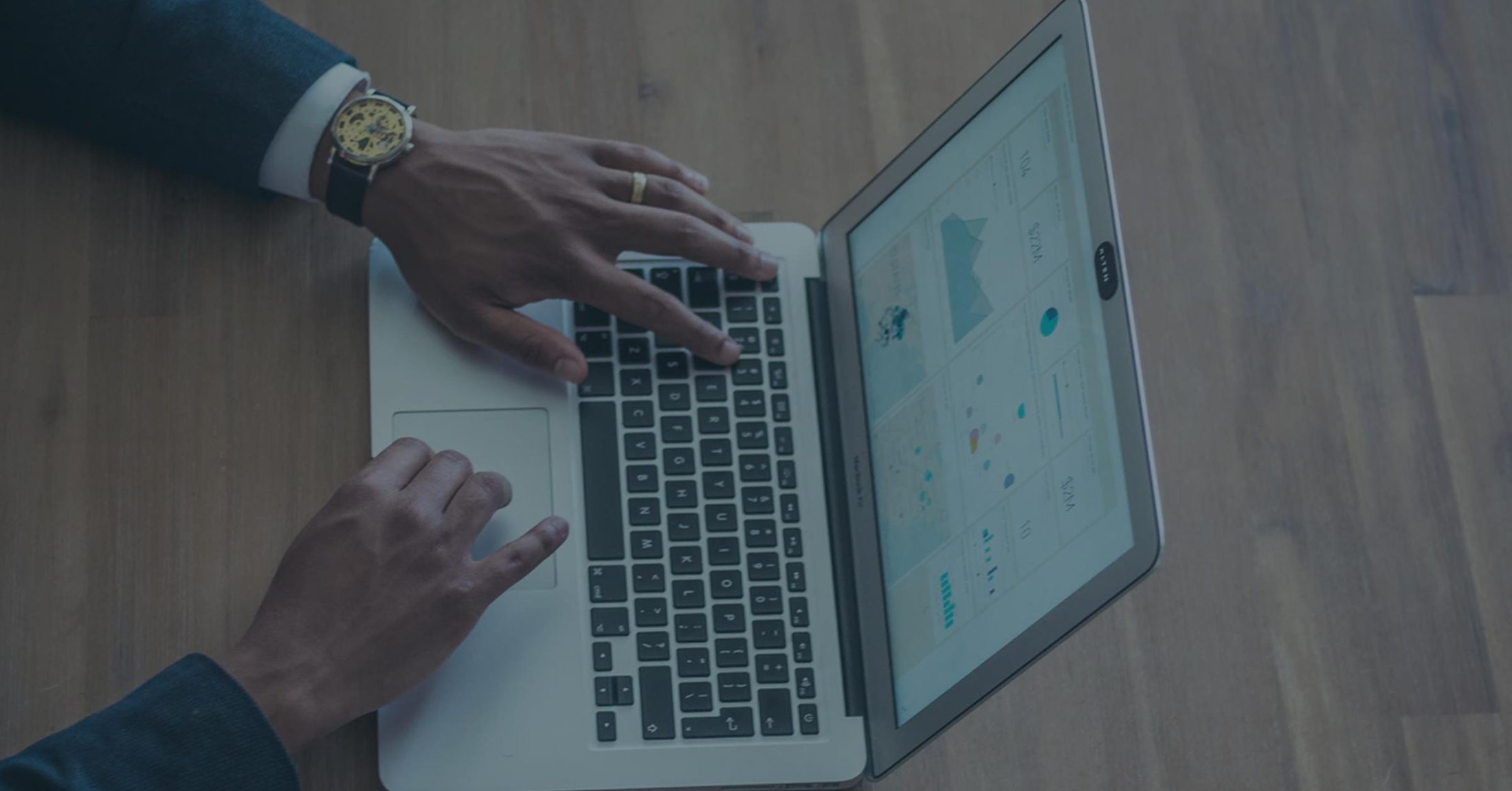 Hands at a laptop
