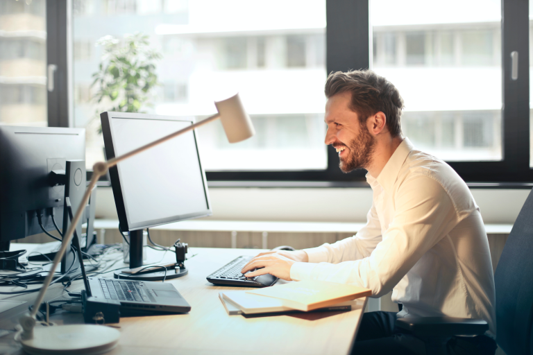 man at desk with computer
