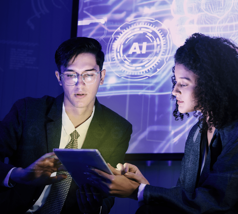 Two professionals collaborating on a tablet with AI interface displayed on screen in a modern office setting