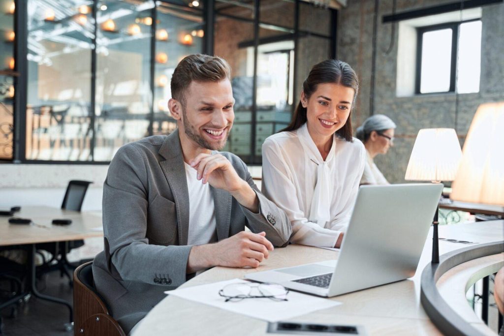 Two people at a laptop