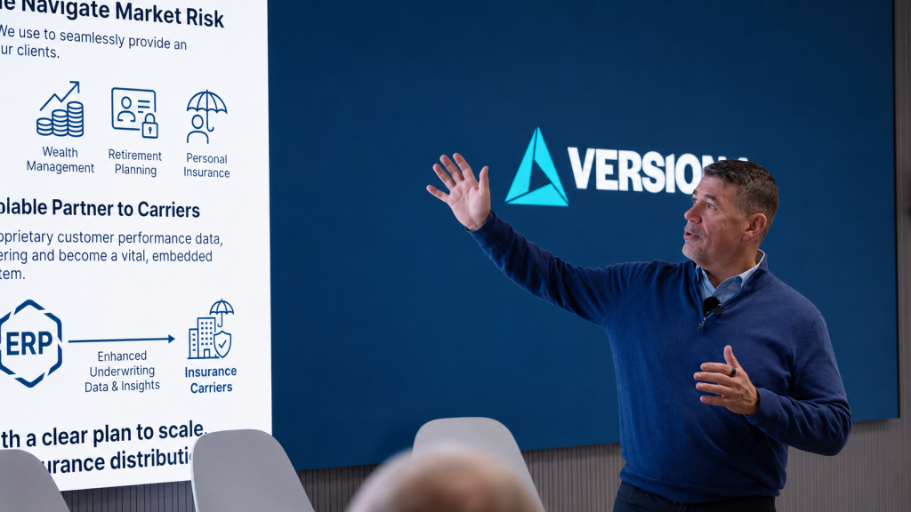Man presenting in a modern conference room, gesturing toward a large screen displaying financial services icons and text, with a corporate logo on a blue background behind him