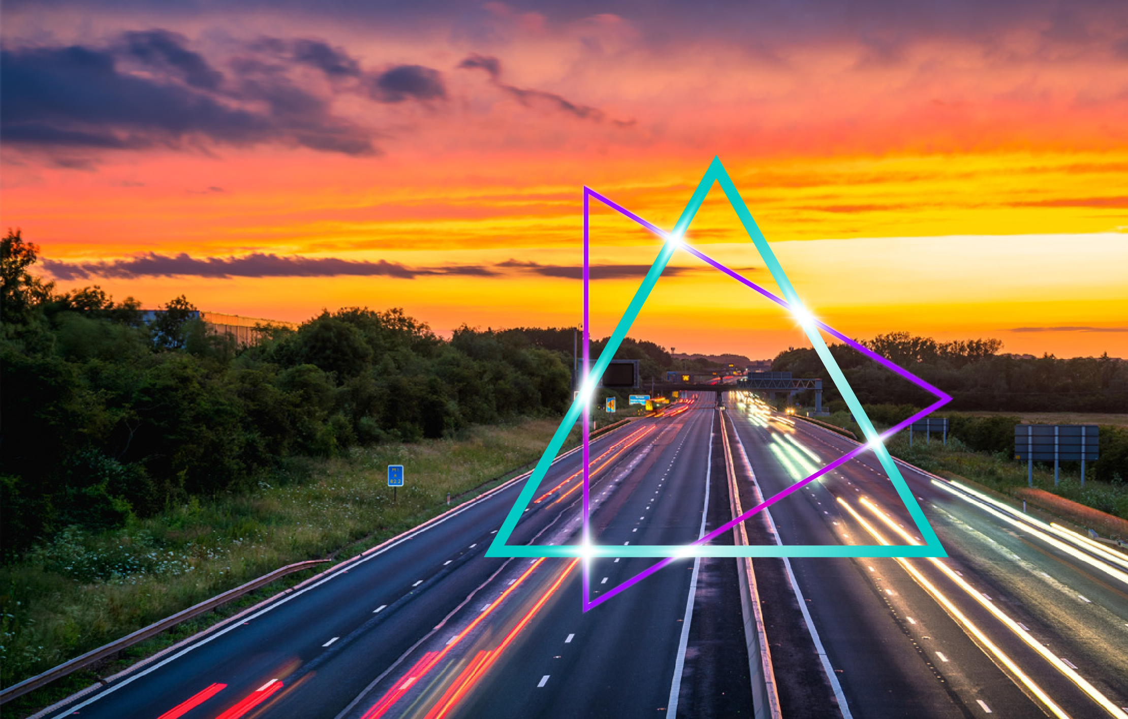 Motorway at sunset with long-exposure light trails from moving vehicles stretching into the distance. The sky glows with vivid orange, yellow and purple tones above tree-lined roads, while an overlay of intersecting turquoise and purple geometric triangles with bright connection points adds a modern, technology-focused visual element symbolising digital transformation, connectivity and innovation.